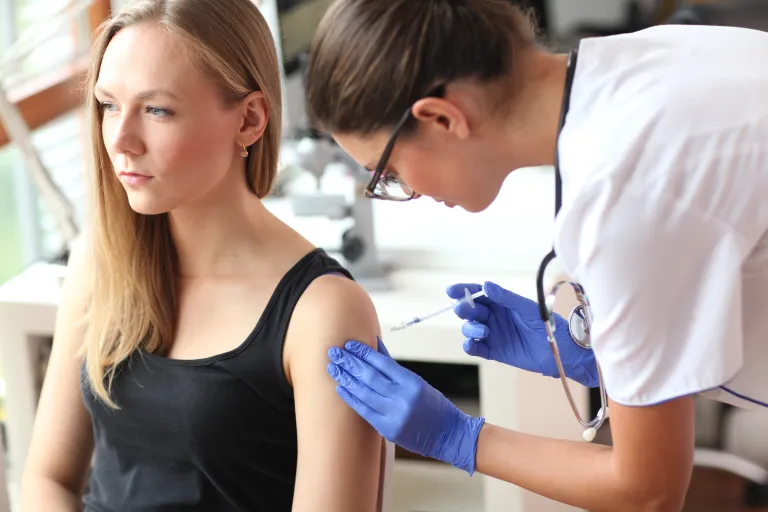 Healthcare professional administering subcutaneous immunotherapy